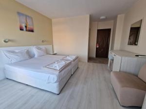 A bed or beds in a room at Exotic Guest House