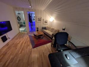 a living room with a couch and a table at Villa Jan in Boden