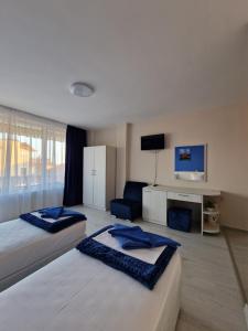 A bed or beds in a room at Exotic Guest House