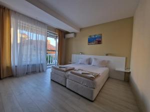 A bed or beds in a room at Exotic Guest House