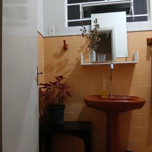 a bathroom with a sink and a mirror at Casa Central in Socorro +6 photos