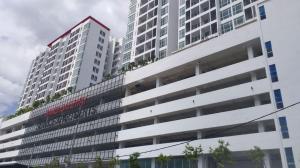 a tall white building with a red sign on it at BangiSky Homestay, Quite, Strategic & Convinient in Bandar Baru Bangi