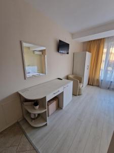 A television and/or entertainment centre at Exotic Guest House