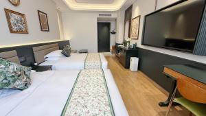 TV o dispositivi per l'intrattenimento presso Vishan Garden Boutique Hotel 厦门维尚花园潮宿 中山路步行街店