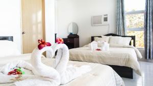 Postel nebo postele na pokoji v ubytování Jaynet Oceanview Resort
