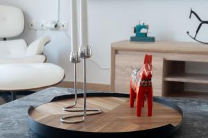 a red toy horse on a table in a room at Villa Sol in Bali in Bali