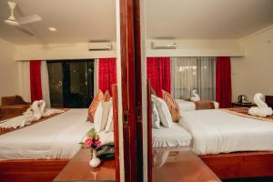 Voodi või voodid majutusasutuse Hotel Jungle Crown toas