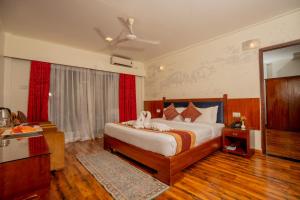 Voodi või voodid majutusasutuse Hotel Jungle Crown toas