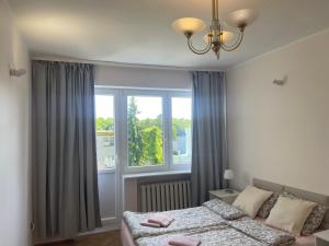 Posteľ alebo postele v izbe v ubytovaní Apartamenty Przy Plaży Gdynia Orłowo