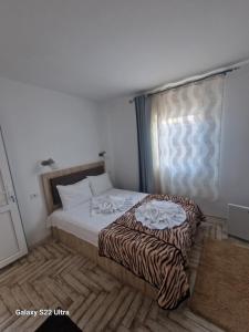 Ένα ή περισσότερα κρεβάτια σε δωμάτιο στο Casa Constantin