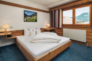 Postel nebo postele na pokoji v ubytování Ferienresidenz Raich - Appartements mit Sky Wellness und Garten