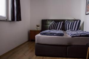 Postel nebo postele na pokoji v ubytování Ferienwohnung Götzis