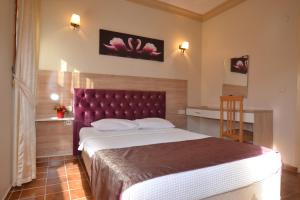 Postel nebo postele na pokoji v ubytování Hotel Konak Su