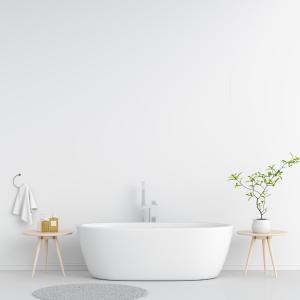 a white bathroom with a tub and two tables at Ataas Apartment Homes Islamabad in Dargai +3 photos