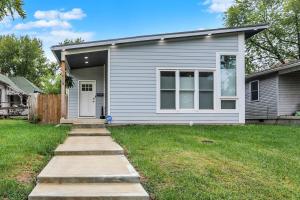 a gray house with a sidewalk in front of it at Close to everything downtown in Indianapolis