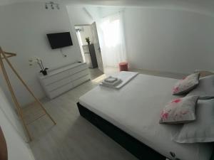 Postel nebo postele na pokoji v ubytování Casa AnaMaria