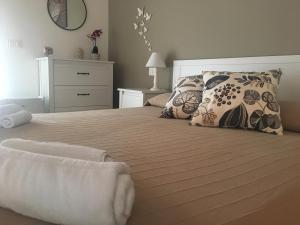 Postel nebo postele na pokoji v ubytování Spegni La Luce b&b