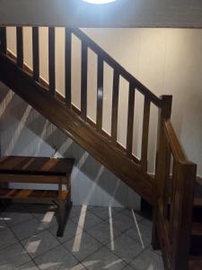 a wooden staircase with a bench next to it at LA PARENTHÈSE AU PAYS DU VERT in Soucht +29 photos