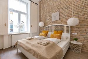 Postel nebo postele na pokoji v ubytování Eiffel Apartment
