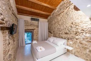 Postel nebo postele na pokoji v ubytování Borgo Baccile by Vini Fantini