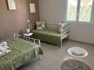 Postel nebo postele na pokoji v ubytování Maison Avalone + 3 fotografie