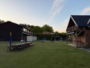 a park with a picnic table and a playground at Apartamenty na klifie in Debina