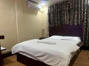 Postel nebo postele na pokoji v ubytování Hotel Sports Pvt Ltd