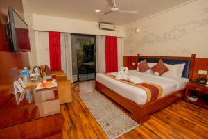Voodi või voodid majutusasutuse Hotel Jungle Crown toas