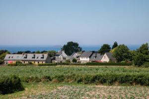 a village with houses and a field of crops at Gîte Kerli cosy 2kms plage in Trévou-Tréguignec