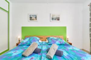 Ένα ή περισσότερα κρεβάτια σε δωμάτιο στο Sirena