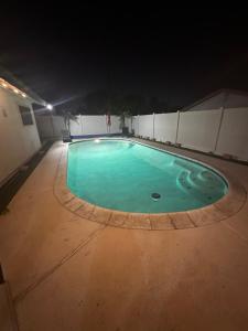 an empty swimming pool in a building at night at Sunset Serenity in Las Vegas