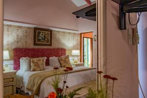 Ένα ή περισσότερα κρεβάτια σε δωμάτιο στο Westlodge at Graskop B&B +199 φωτογραφίες