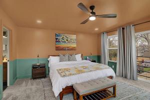 a bedroom with a bed and a ceiling fan at Walk to Bars and Restaurants in Fountain Square in Indianapolis +45 photos