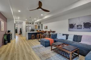 a living room with a blue couch and a table at Walk to Bars and Restaurants in Fountain Square in Indianapolis