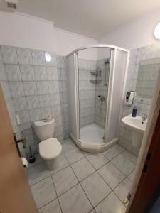 Koupelna v ubytování Hotel Hokejka