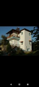 a large white building with a balcony on it at Blue oasis villa plaka-leptokaria in Leptokaria
