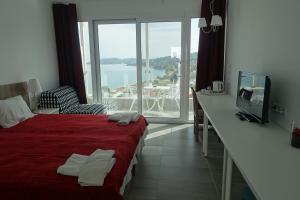 Postel nebo postele na pokoji v ubytování Hotel Rene + 37 fotografií