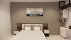 Ένα ή περισσότερα κρεβάτια σε δωμάτιο στο Saigon Nam Long Hotel