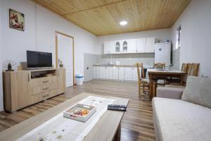 a living room with a couch and a table at Vikendica Cemerno in Gacko