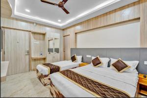 Ένα ή περισσότερα κρεβάτια σε δωμάτιο στο Wooden Park Hotel - Near DLF IT Park