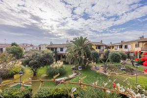 a courtyard with a park with buildings and trees at Terrazza porto San Paolo in Porto San Paolo