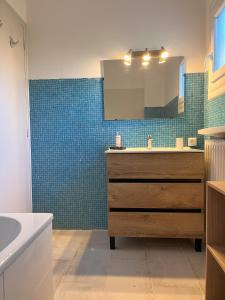a bathroom with a sink and a mirror at MAS Élancia in Argelès-sur-Mer