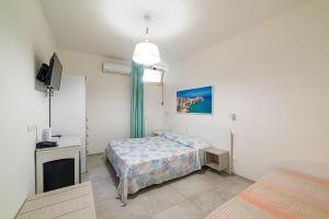 Katil atau katil-katil dalam bilik di Hotel Approdo di Venere