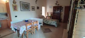 a living room with a table and a couch at Casa Anna in Cento
