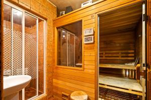 a bathroom with a toilet and a sink at Urban Spa House Jacuzzi, Sauna, Taras & Grill ! No Parties in Warsaw