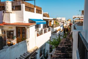 a view of a city street with white buildings at Marbella Village in Marbella
