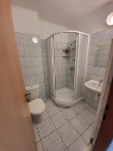 Koupelna v ubytování Hotel Hokejka