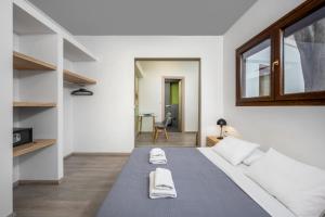 Postel nebo postele na pokoji v ubytování Mulberry Apartments