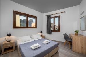 Postel nebo postele na pokoji v ubytování Mulberry Apartments