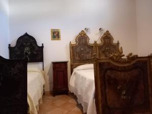 Postel nebo postele na pokoji v ubytování BOTTE - Appartementi Il Palmento